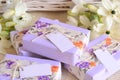 Wedding gifts details guest favors boxes soaps with purple white color decoration stripped paper floral fabric Royalty Free Stock Photo