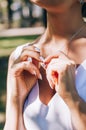 Wedding. The girl in a white dress and a guy in a suit sitting on a wooden chair, and holding a beautiful bouquet of white, blue, Royalty Free Stock Photo