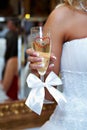 Wedding glass of champagne in hand bride