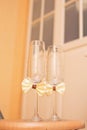 The wedding glasses decorated with a bow Royalty Free Stock Photo