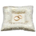 Wedding gold rings bride and groom on decorative pillow. Royalty Free Stock Photo