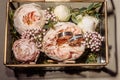 wedding gold rings in a glass box lie next to a wedding bouquet with austom. aesthetics and details of the wedding Royalty Free Stock Photo