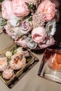 wedding gold rings in a glass box lie next to a wedding bouquet with austom. aesthetics and details of the wedding Royalty Free Stock Photo