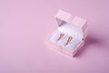 Wedding gold rings in pink gift box on soft pink background Royalty Free Stock Photo