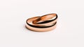 Wedding Golden Rings lie on white rotating background surface