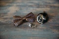 Wedding groom accessories, details of clothes, bow tie, cuff links, wristwatches. Royalty Free Stock Photo
