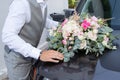 Wedding groom next to marriage car with bouquets flowers Royalty Free Stock Photo