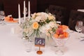 Wedding guest table decorated with bouquet and settings Royalty Free Stock Photo