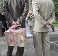 Wedding guests holding gift