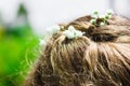 Wedding hairstyle flowers in hair. Little girl at christening. Bride fashion. Royalty Free Stock Photo