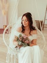 Wedding hairstyle and makeup, beautiful young bride with flowers wreath at marriage morning, happy caucasian girl bridal