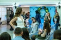 A bride model in a white wedding dress passing guests