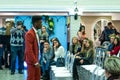 An afro-american groom model demonstraits a wedding suit to the guests