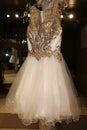 Wedding industry- Curly edge tulle on a designer gold and ivory short wedding gown Royalty Free Stock Photo