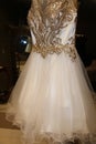 Wedding industry- Curly edge tulle on a designer gold and ivory short wedding gown