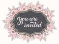 Wedding invitation and announcement card with floral frame and You are invited text. Elegant ornate border with