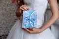 Wedding invitation blue card in hands Royalty Free Stock Photo