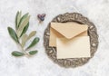 Blank card and envelope on table with olive tree branches Royalty Free Stock Photo