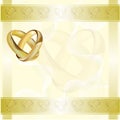 A wedding invitation card with gold rings