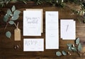 Wedding Invitation Cards Papers Laying on Table Decorate With Le Royalty Free Stock Photo