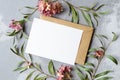 Wedding invitation or greeting card with empty space mockup with envelope and flowers decorations.