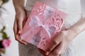 Wedding invitation pink card In the hands of the bride Royalty Free Stock Photo