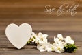 Wedding invitation with spring flowers and decorative heart Royalty Free Stock Photo