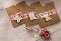 Wedding invitations in the craft envelopes. Wedding concept. Wedding accessories. Invitations, perfume bottle, flowers