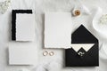 Wedding invites and envelopes on white background top view. Handmade wedding stationery set