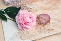 Wedding jewelry made of crystals, peony flower and lace mesh fabric, delicate romantic background