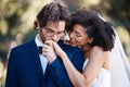 Wedding, kiss on hand and happy couple outdoor for marriage celebration event together with commitment. Interracial man Royalty Free Stock Photo