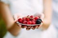 Wedding koets on plate with raspberry berries Royalty Free Stock Photo