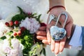 Wedding lock with keys in the hands of the newlyweds. Wedding traditions and signs Royalty Free Stock Photo