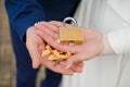 Wedding lock and keys on the palms of the bride and groom Royalty Free Stock Photo