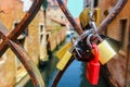 Wedding locks of lovers on bridge fence in Venice
