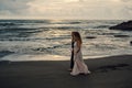 Wedding lovestory, just married couple near the ocean at sunset Royalty Free Stock Photo