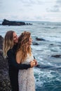 Wedding lovestory, just married couple near the ocean at sunset Royalty Free Stock Photo