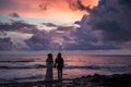 Wedding lovestory, just married couple near the ocean at sunset Royalty Free Stock Photo