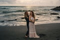 Wedding lovestory, just married couple near the ocean at sunset Royalty Free Stock Photo