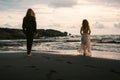 Wedding lovestory, just married couple near the ocean at sunset Royalty Free Stock Photo