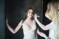 Wedding makeup artist making a makeup for bride. Beautiful model