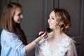 Wedding makeup artist making a make up for bride Royalty Free Stock Photo