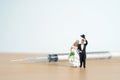 Wedding marriage and couple medical check-up concept miniature people toy photography. Bride and groom with syringes injection