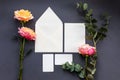 A wedding mock up composition. Wedding Invitation, envelope, paper cards with peony rose flower and sprig of eucalyptus