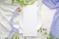 Wedding mockup menu with violet flowers and delicate silk ribbons on a white background. Greeting card or wedding invitation with Royalty Free Stock Photo