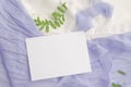 Wedding mockup with violet flowers and delicate silk ribbons on a white background. Greeting card or wedding invitation with Royalty Free Stock Photo