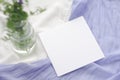 Wedding mockup with violet flowers and delicate silk ribbons on a white background. Greeting card or wedding invitation with Royalty Free Stock Photo