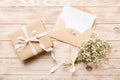 Wedding mockup with white paper list and flowers gypsophila on colored table top view flat lay. Blank greeting cards and Royalty Free Stock Photo