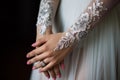 Wedding nail design of the bride, beautiful hands of the bride with well-groomed manicure