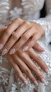 Wedding nail design of the bride, beautiful hands of the bride with well-groomed manicure